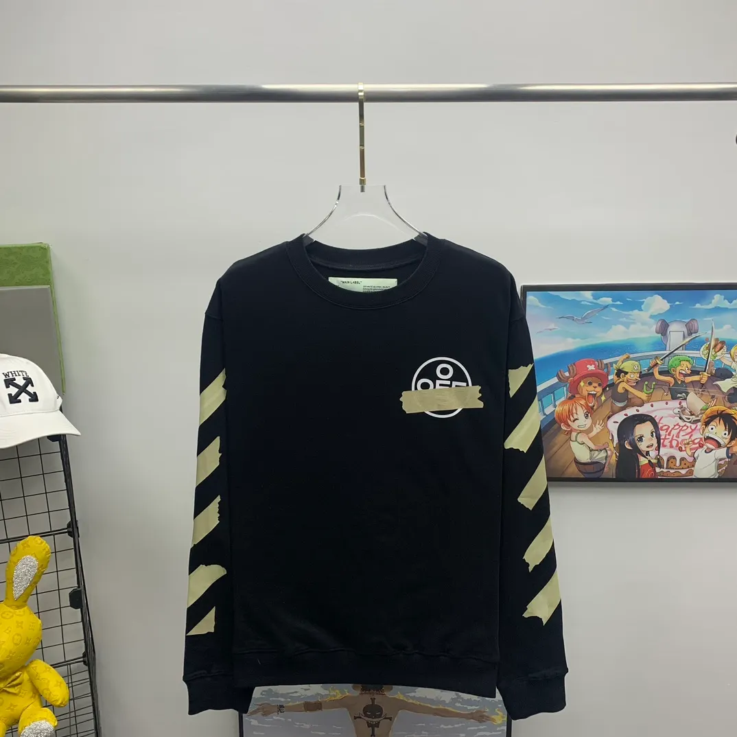 Top tested version OFF WHITE OW hot stamping strip printing male and female couple pure cotton loose same style pullover hooded sweatshirt The printing is done on a Japanese-owned Mimaki printing machine, with no edges or burrs. Inkjet heat transfer is hot-pressed and cold-teared, and the high temperature is 180 degrees. The front piece needs to be pressed twice (the second time requires 180kg of air pressure). The transparent fabric is anti-scratch and ironing, and the printing is fog-free. The semi-transparent tape in the front circle can reveal the part of the printing underneath. The golden printing color of the tape is not The flat color and tape printing overlap have different color depths. The wash label is also customized according to the original font. The accessories still use the full line of correct accessories. The rectangular woven collar label design is cancelled. The previous three-dimensional silicone feel font is changed to a fully woven collar label. Fluorescent fonts can be seen on the collar label. The five-link silicone hangtag, three-link washable label and zebra crossing packaging line are still the same. 480g pure cotton terry fabric, a major launch with full drape. A full set of customized accessories, one-to-one mold opening, professional ow. Size: XS-L Size chart